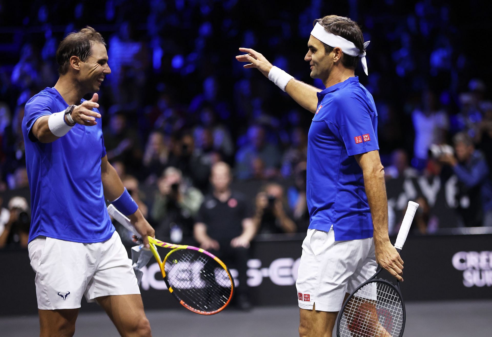 Roger Federer and Rafael Nadal of Team Europe walk to embrace each other at the Laver Cup 2022
