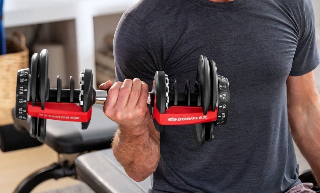 Everything you need to know about adjustable dumbbells. (Photo via Bowflex