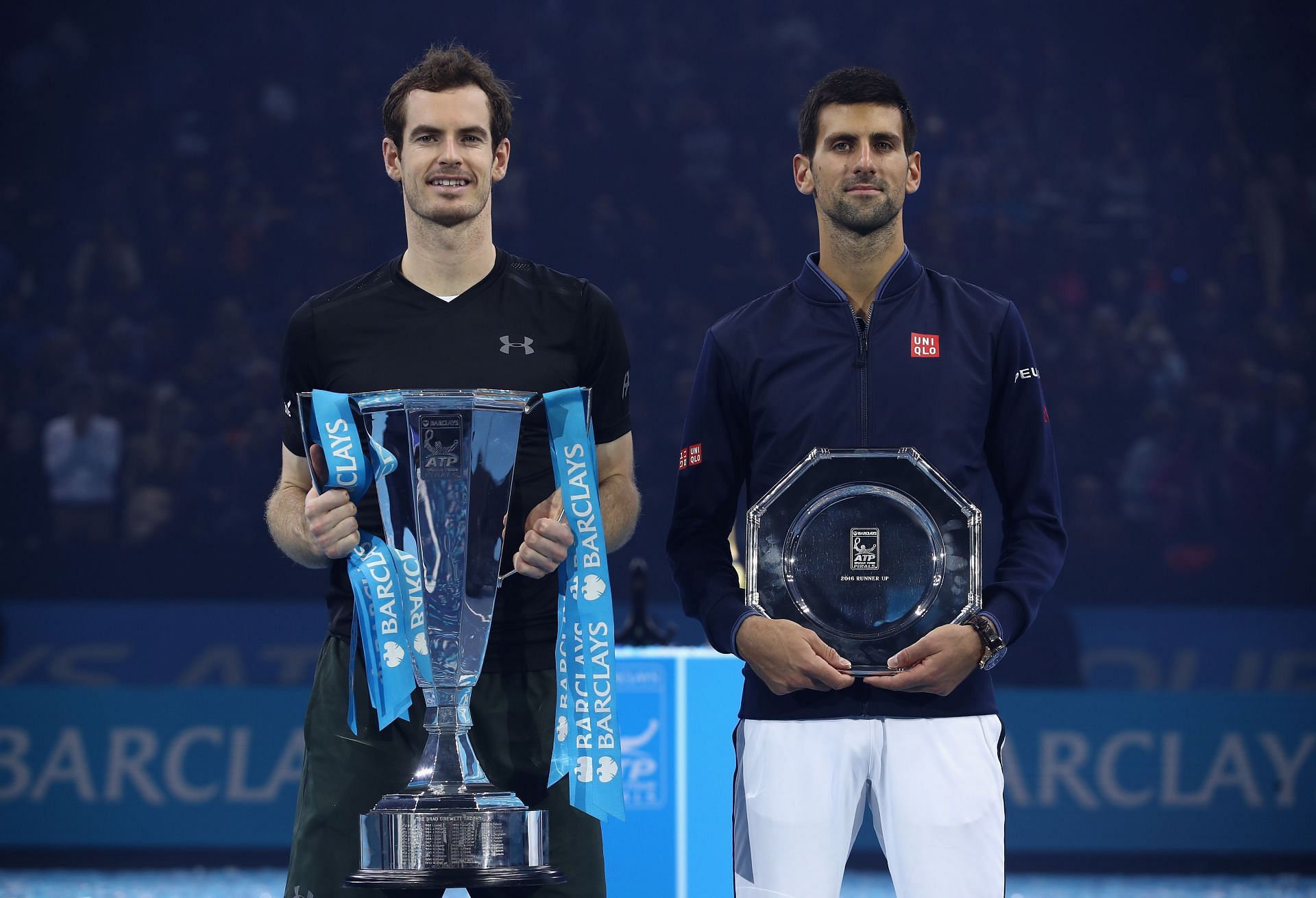 Andy Murray (L) &amp; Novak Djokovic with their trophies at the 2016 ATP Finals
