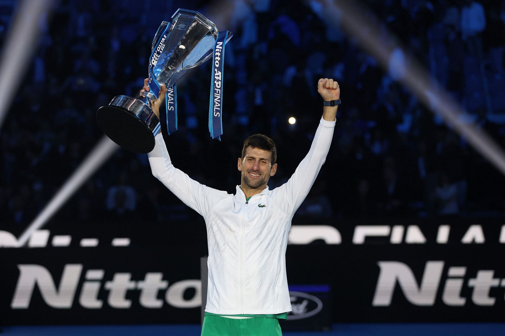 Novak Djokovic poses with the trophy after defeating Casper Ruud at the 2022 ATP Finals