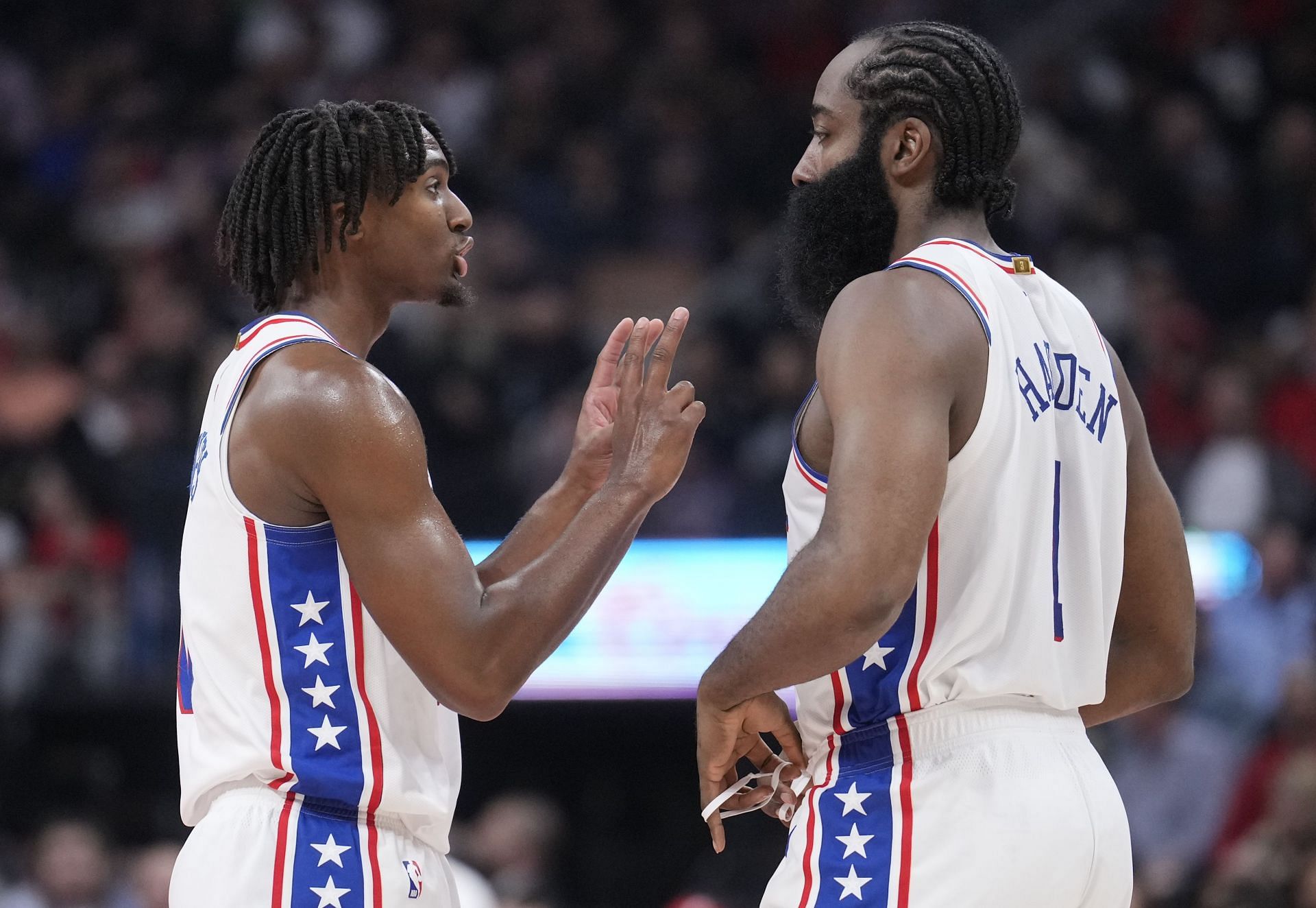 James Harden in conversation with Tyrese Maxey