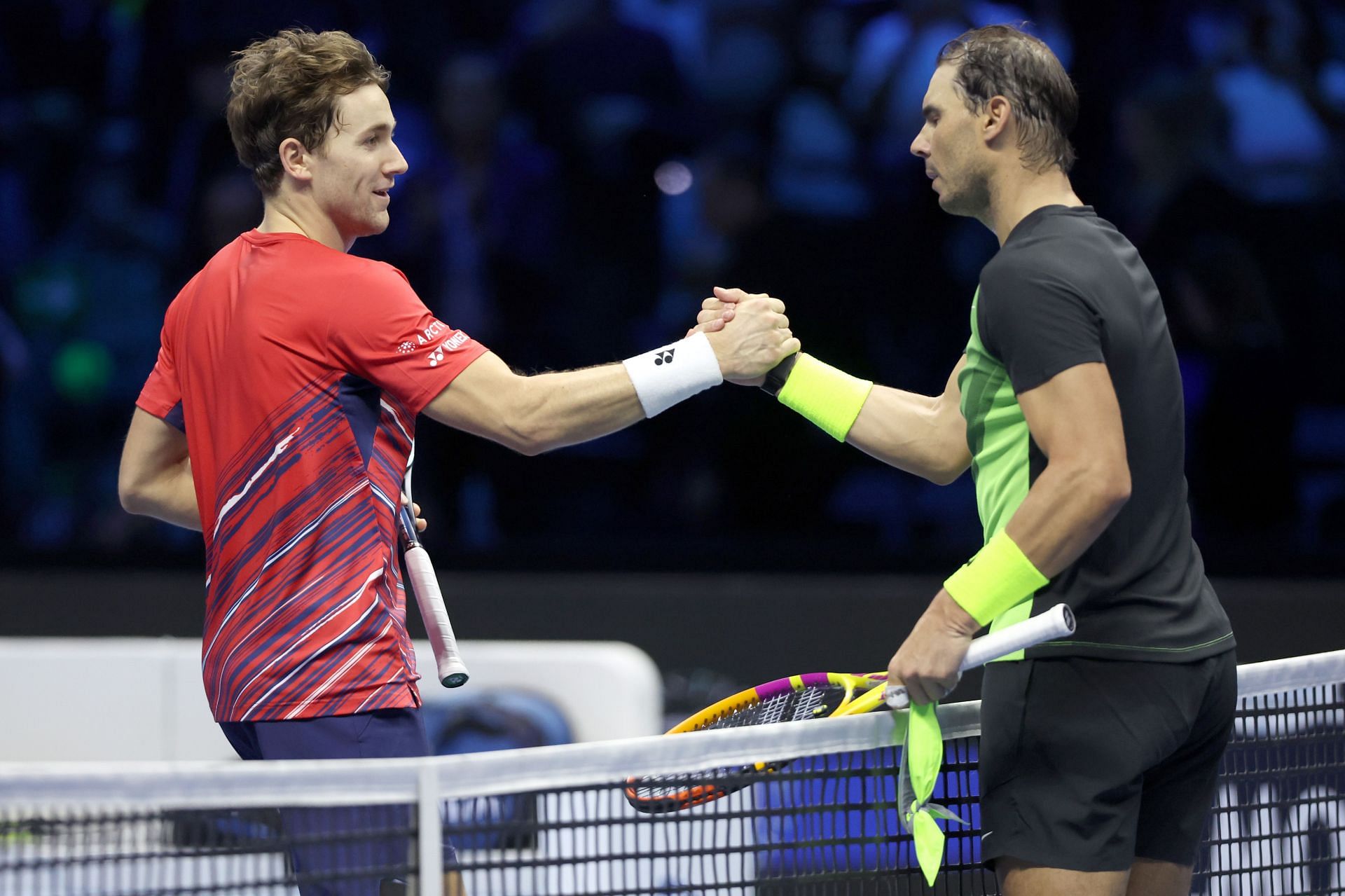 Casper Ruud (L) congratulates Rafael Nadal after their match at the 2022 ATP Finals