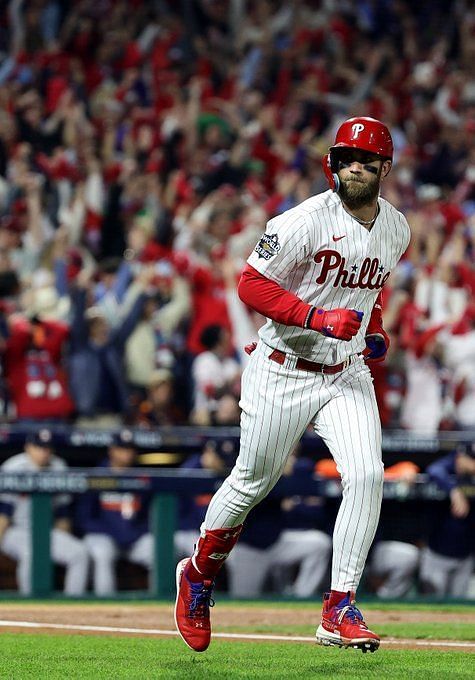 Phillies' Bryce Harper ejected after charging Rockies dugout –