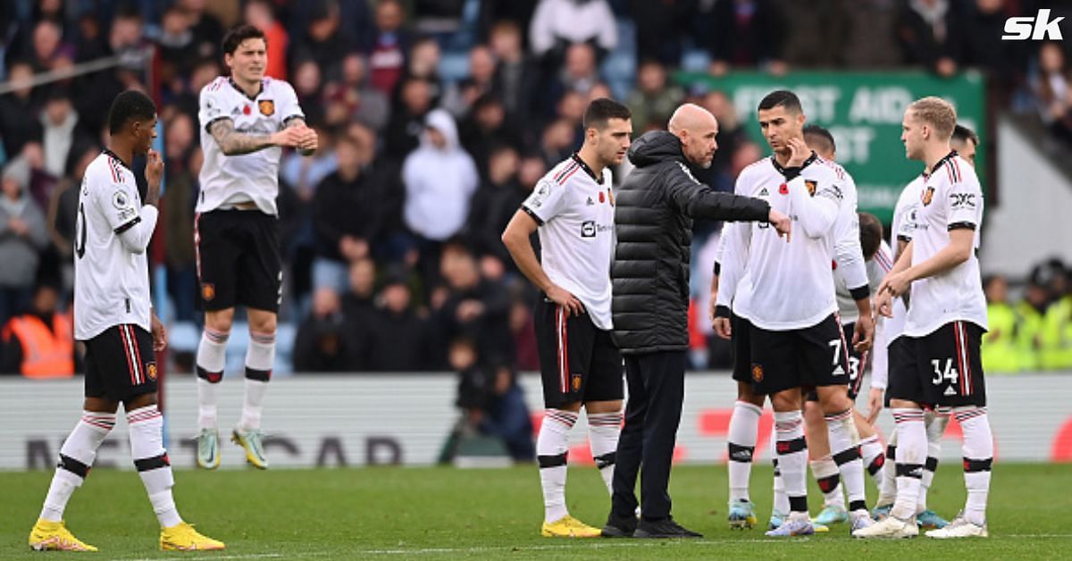 Manchester United manager Erik ten Hag speaks to his players prior to the second half of their match against Aston Villa.