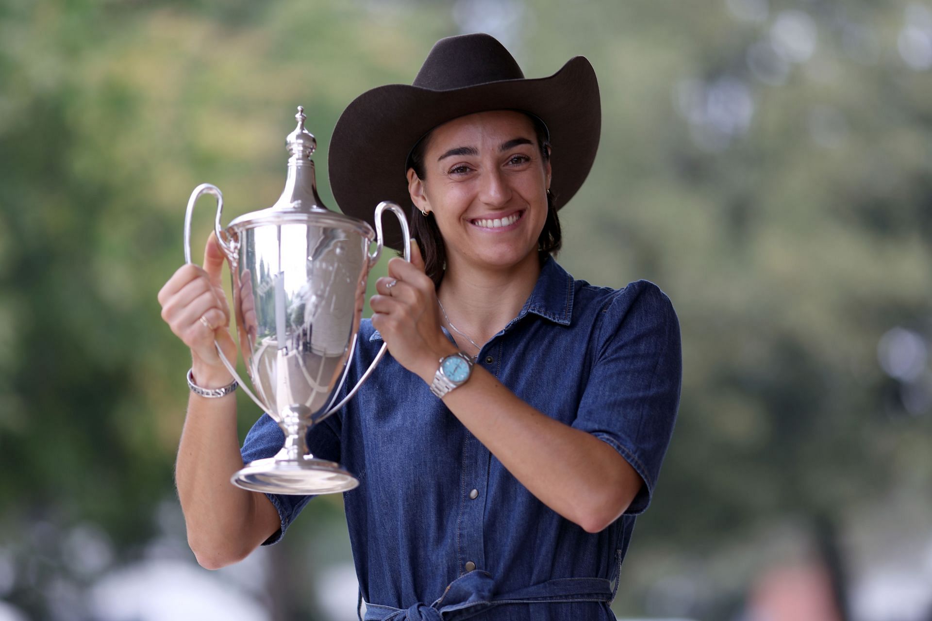 Caroline Garcia holds her WTA Finals trophy.