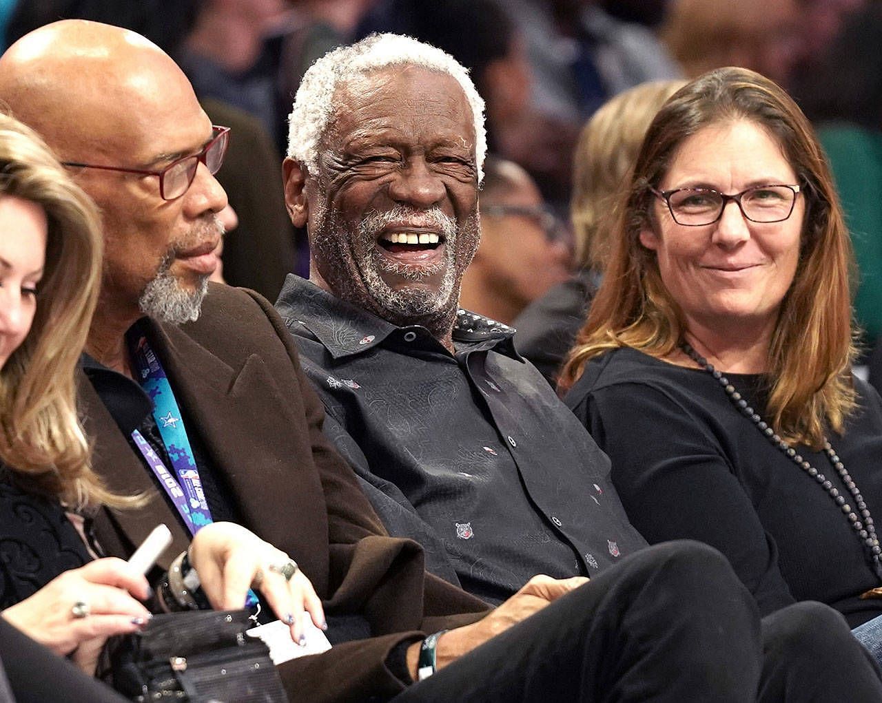 Bill Russell with his wife Jeannine Russell (right) at an NBA game with Kareem Abdul-Jabbar (left)
