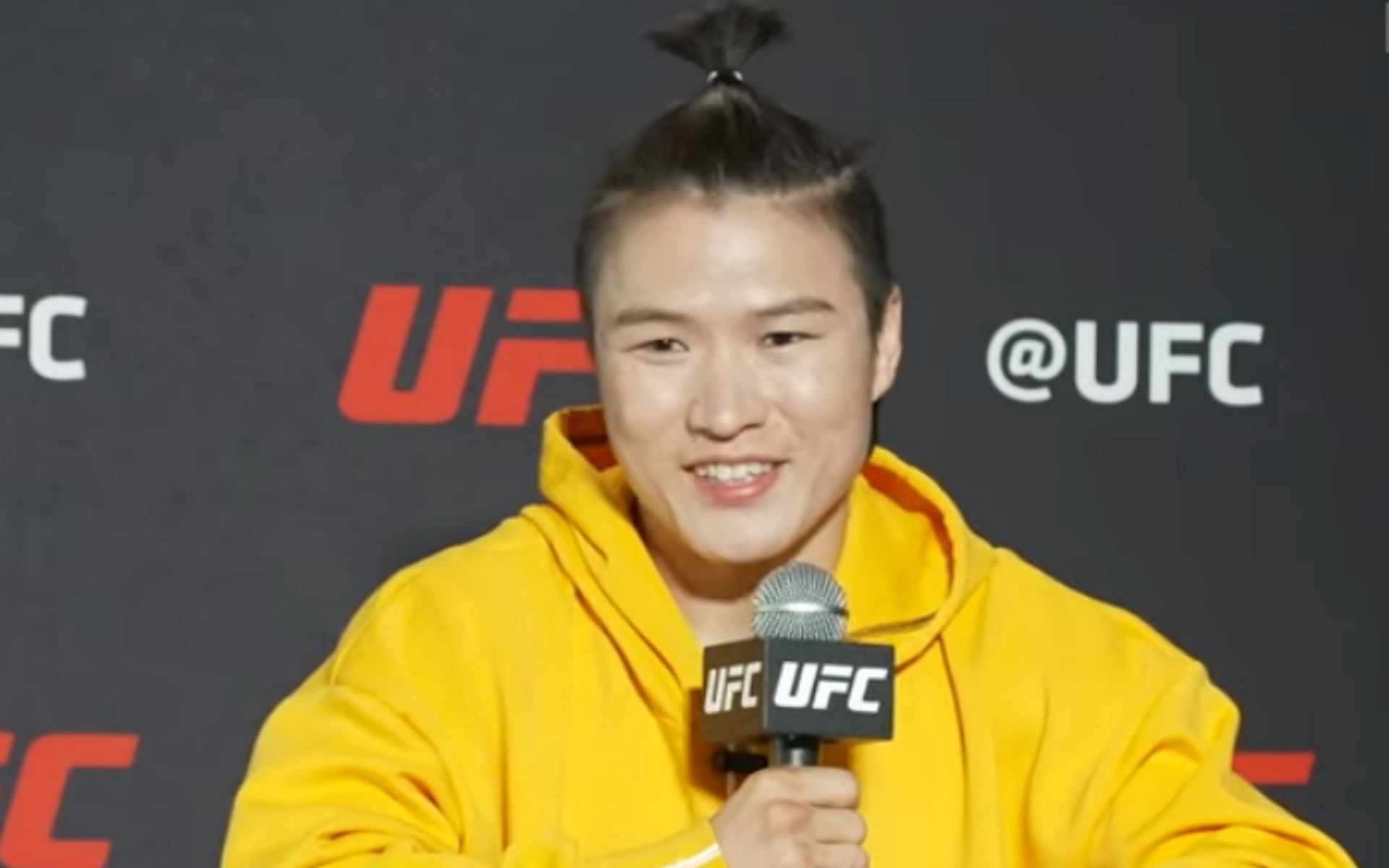 Zhang Weili speaks with reporters at UFC Fight Night 215 (Photo credit: MMA Junkie - YouTube)