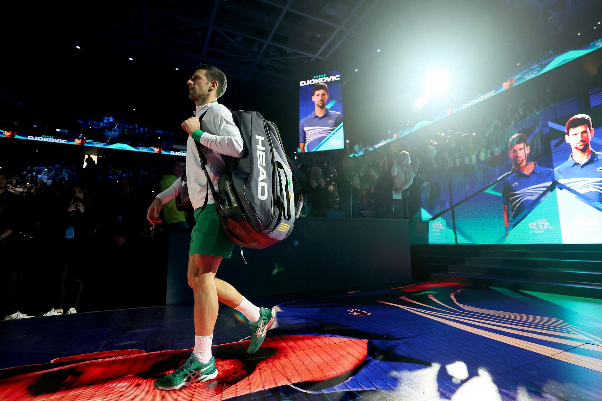 Novak Djokovic walks onto the court for his match against Taylor Fritz at the 2022 ATP Finals