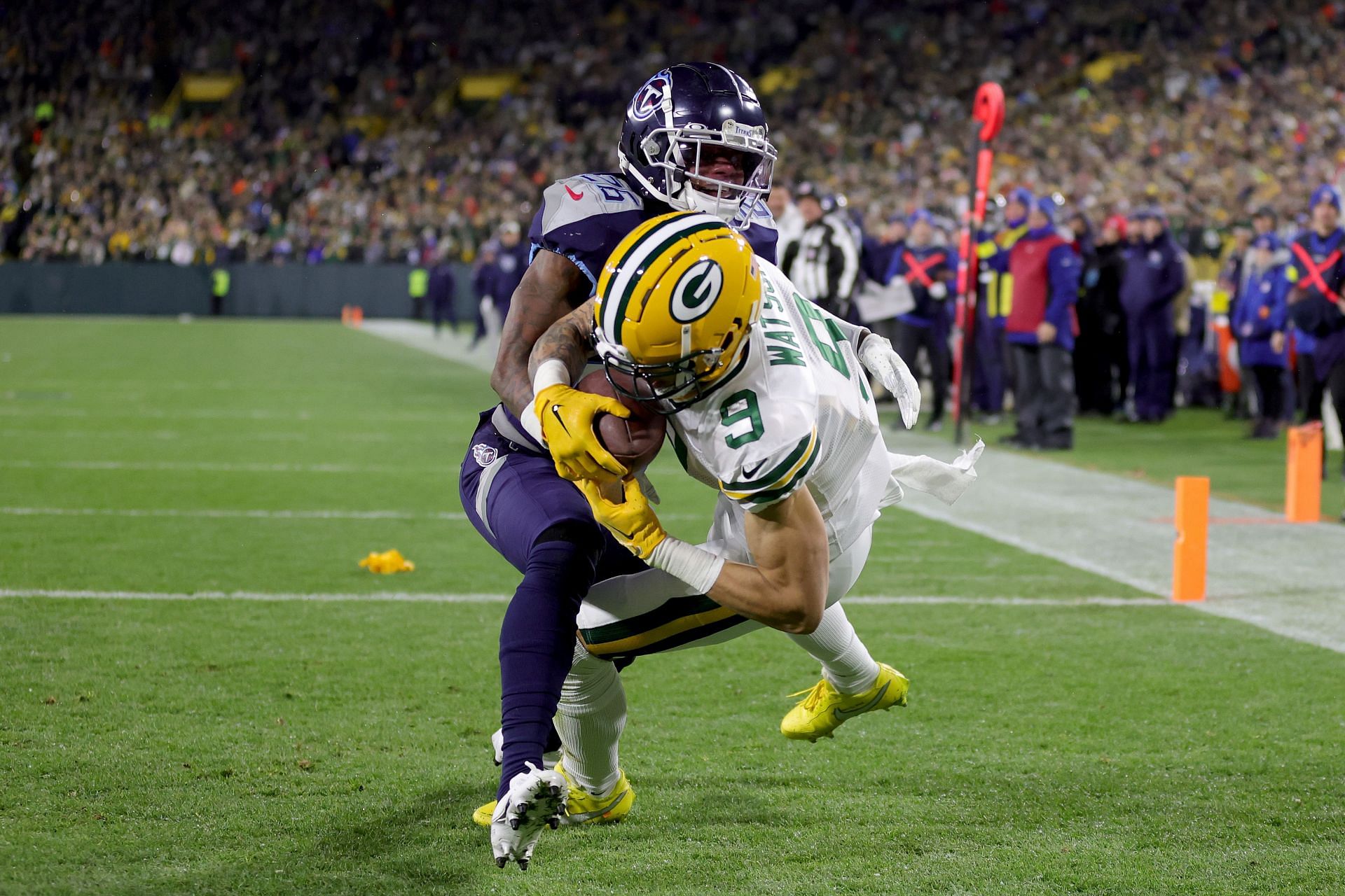 Christian Watson scores a touchdown against the Tennessee Titans in Week 11