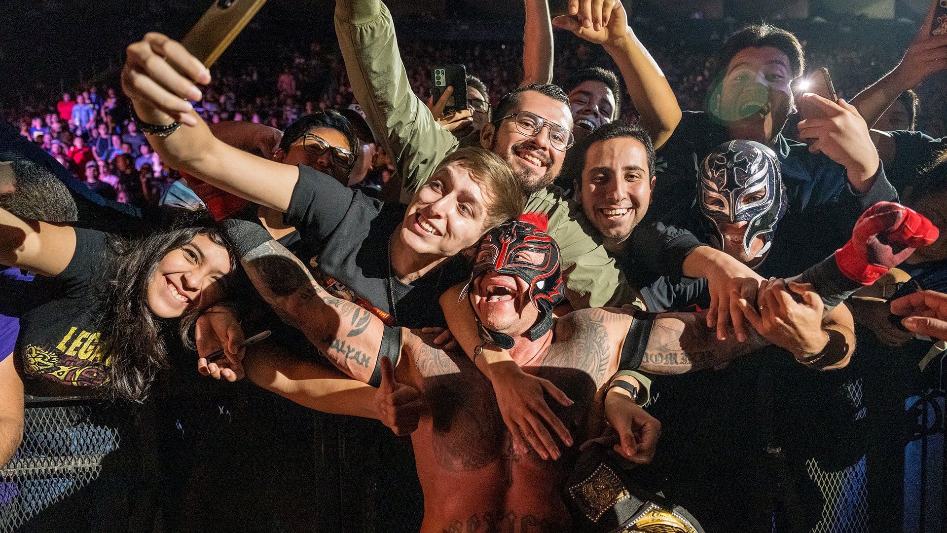 Rey Mysterio celebrates with the fans