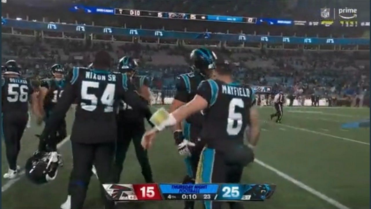 Panthers' Baker Mayfield goes viral for headbutting teammates without  helmet after victory over Falcons