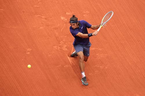 Lorenzo Musetti in action during an earlier match