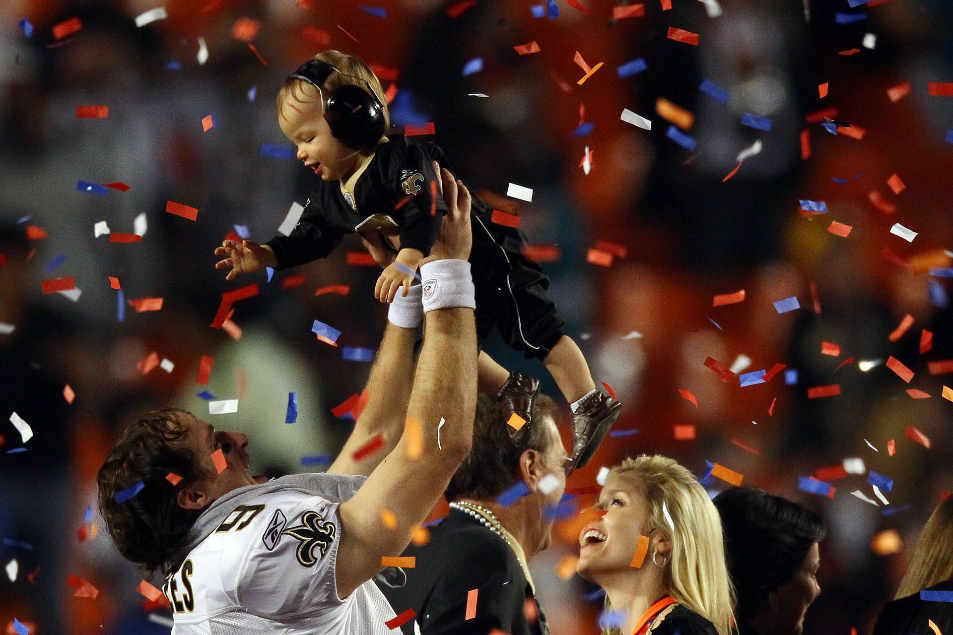 Drew Brees celebrating the New Orleans Saints&#039; Super Bowl XLIV win with his son and family