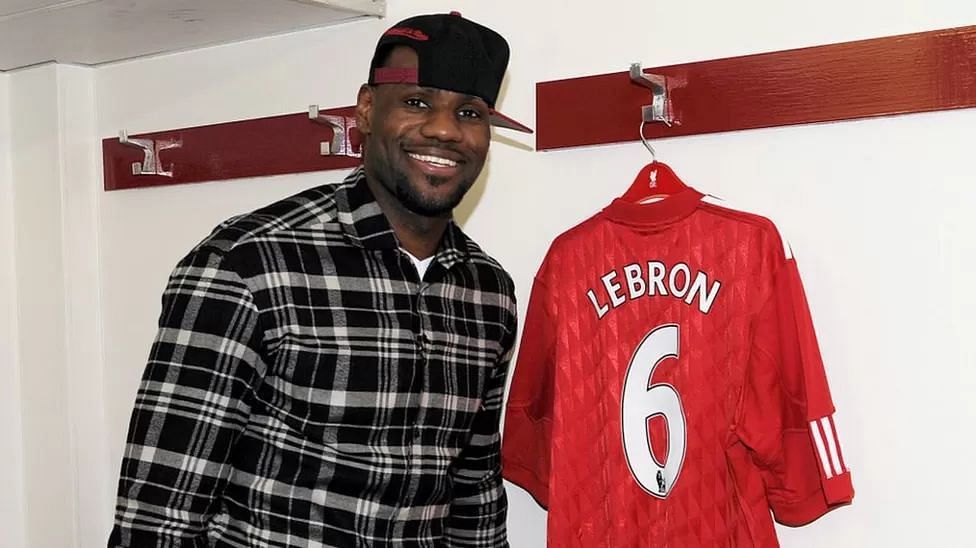 LeBron James posing with a custom Liverpool FC jersey