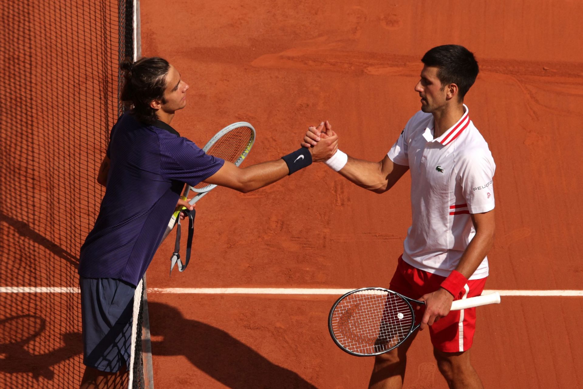 Lorenzo Musetti (L) and Novak Djokovic