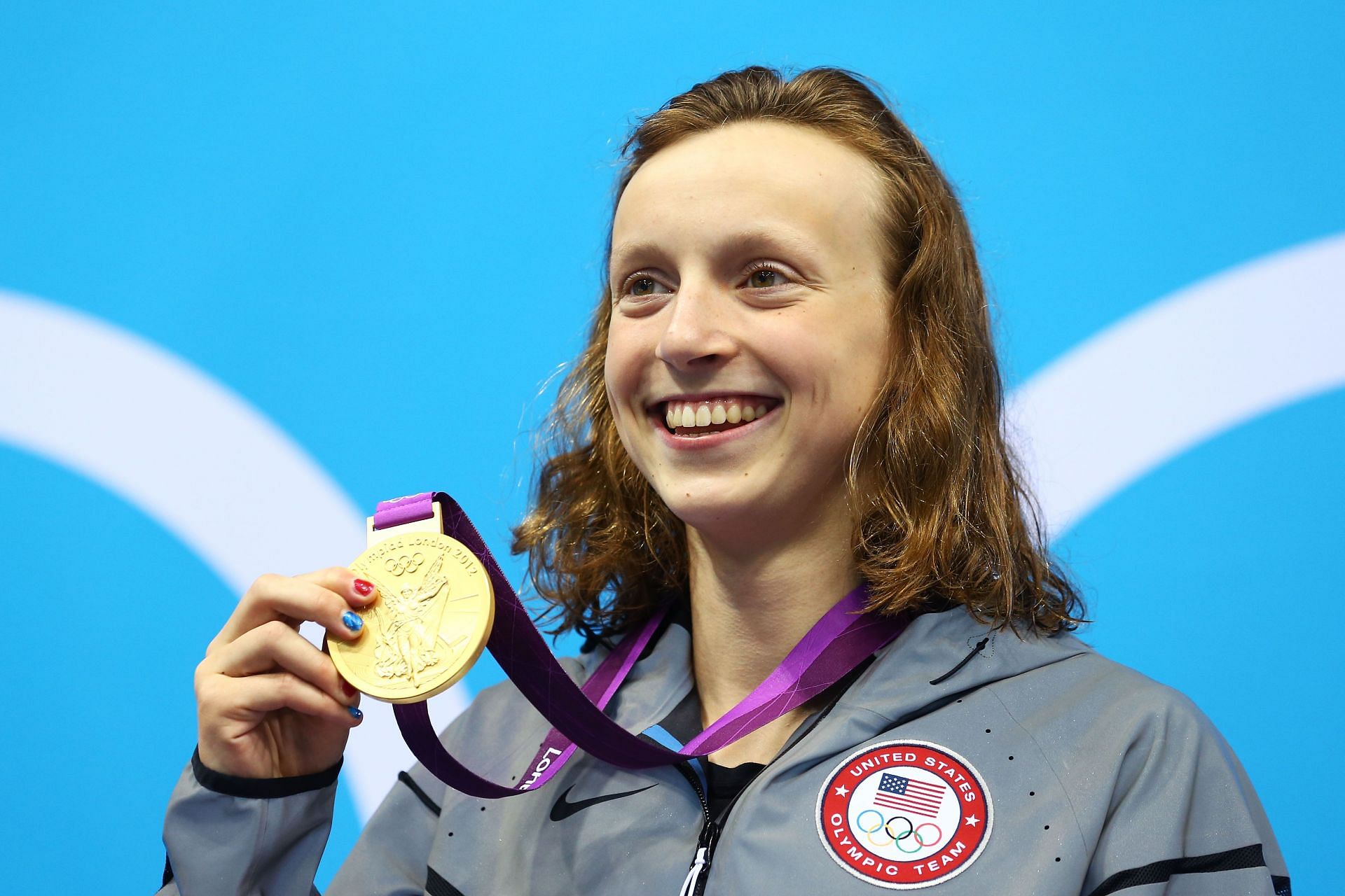 Katie Ledecky poses with her medal after winning the 800 meter freestyle during the 2012 London Olympics