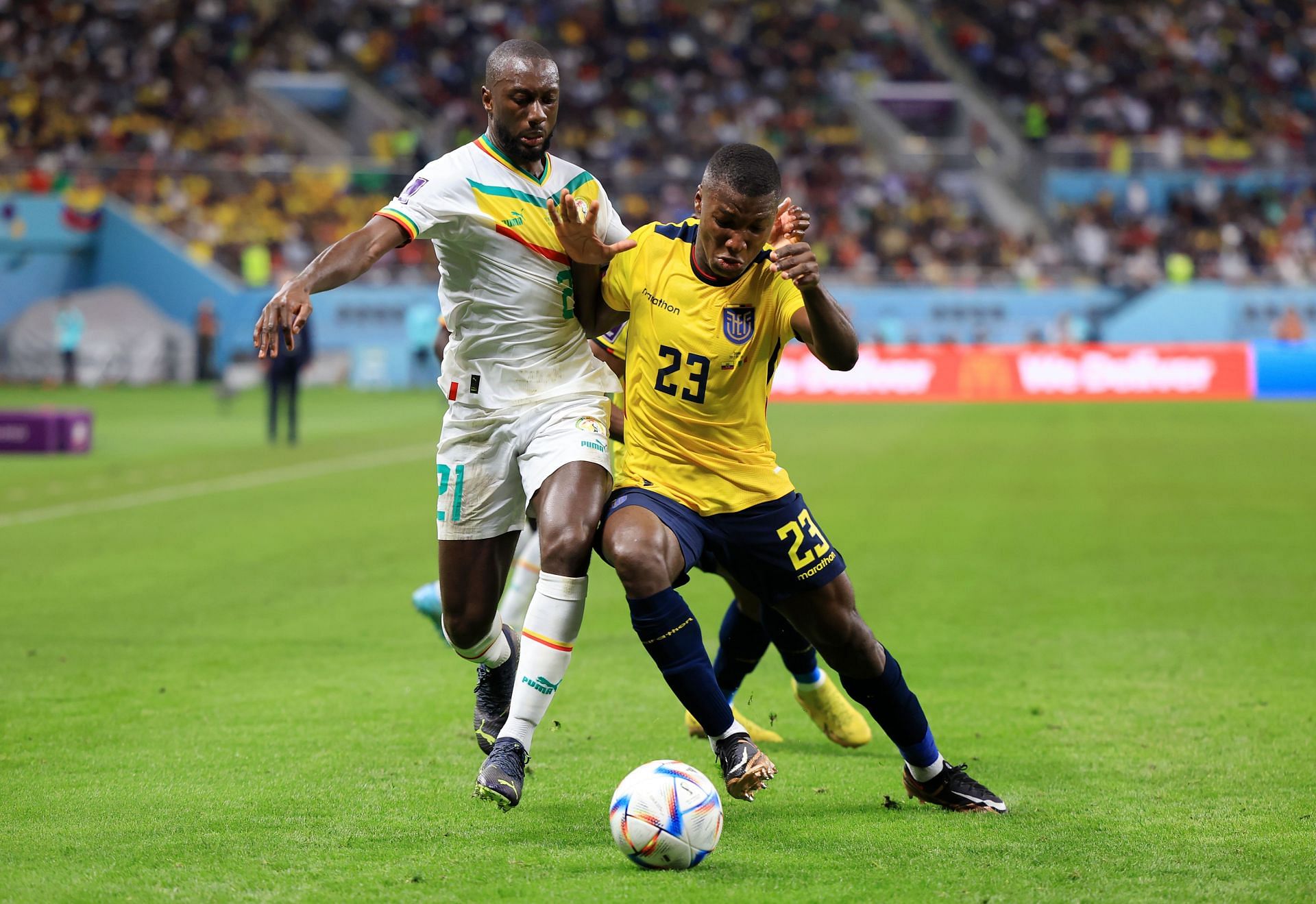 Youssouf Sabaly battles for possession with Moises Caicedo.