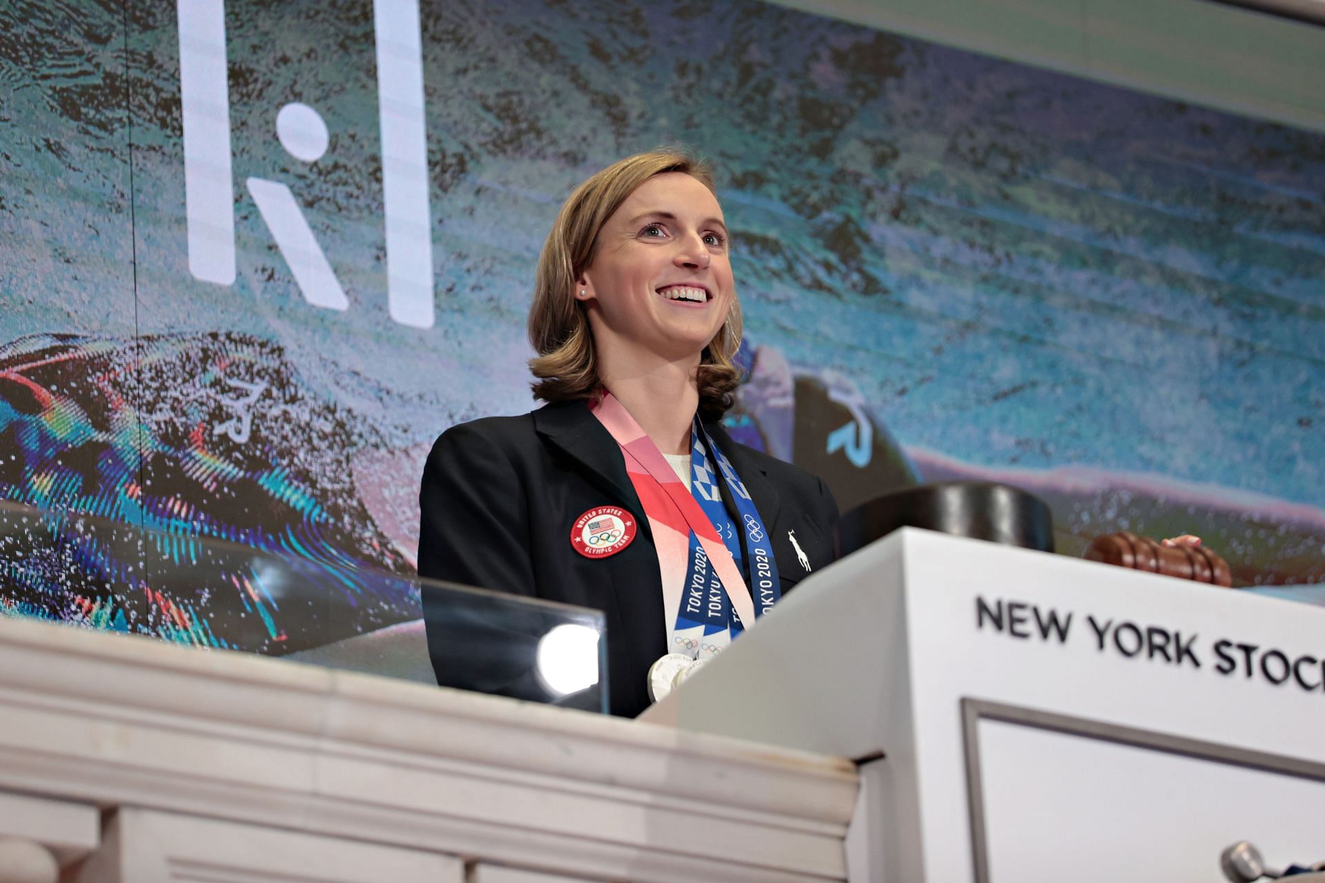 Olympic Swimmer Katie Ledecky rings New York Stock Exchange Closing Bell, 2022 (Image via Getty)