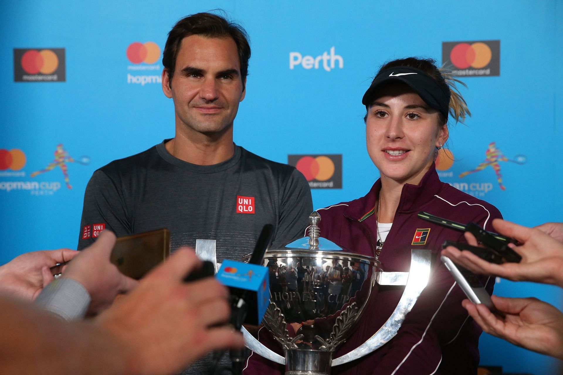 Roger Federer (L) and Belinda Bencic