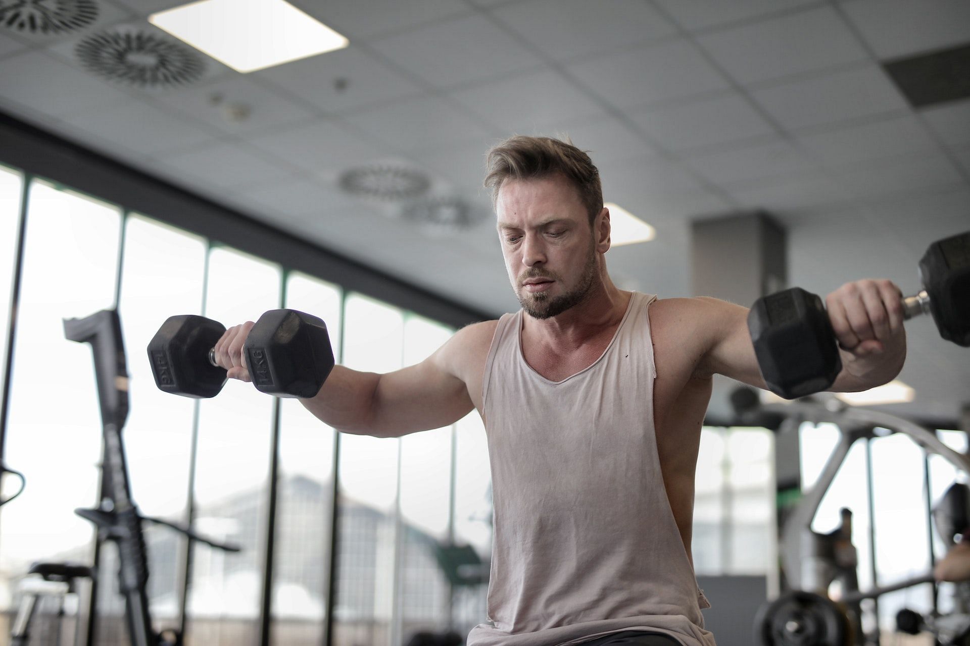 cable kneeling bent lateral raises