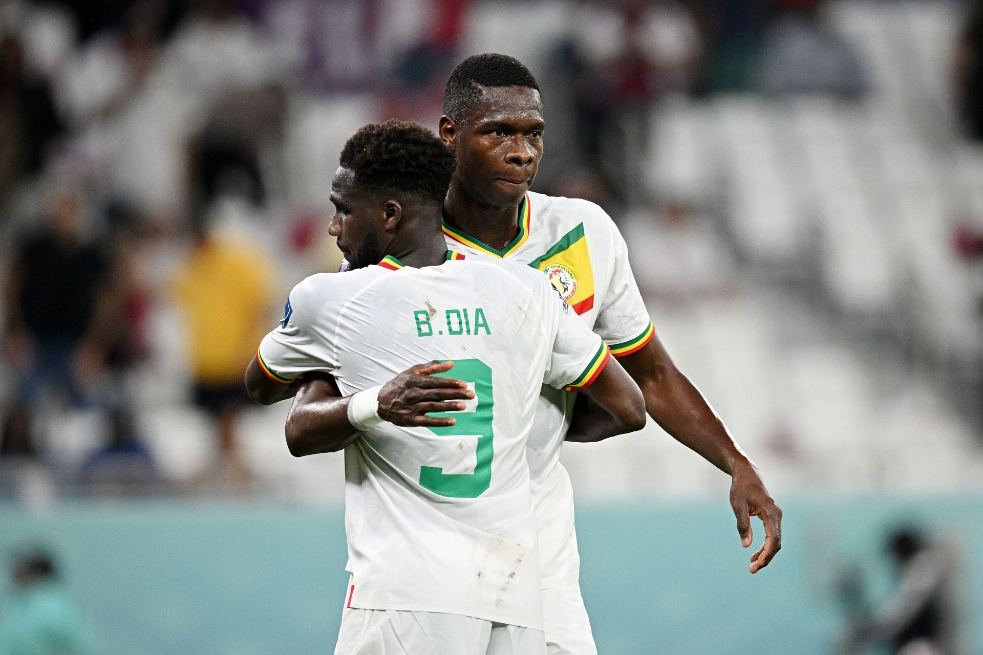 Boulaye Dia (L) and Pape Abou Cisse celebrate Senegal's 3-1 win against Qatar.