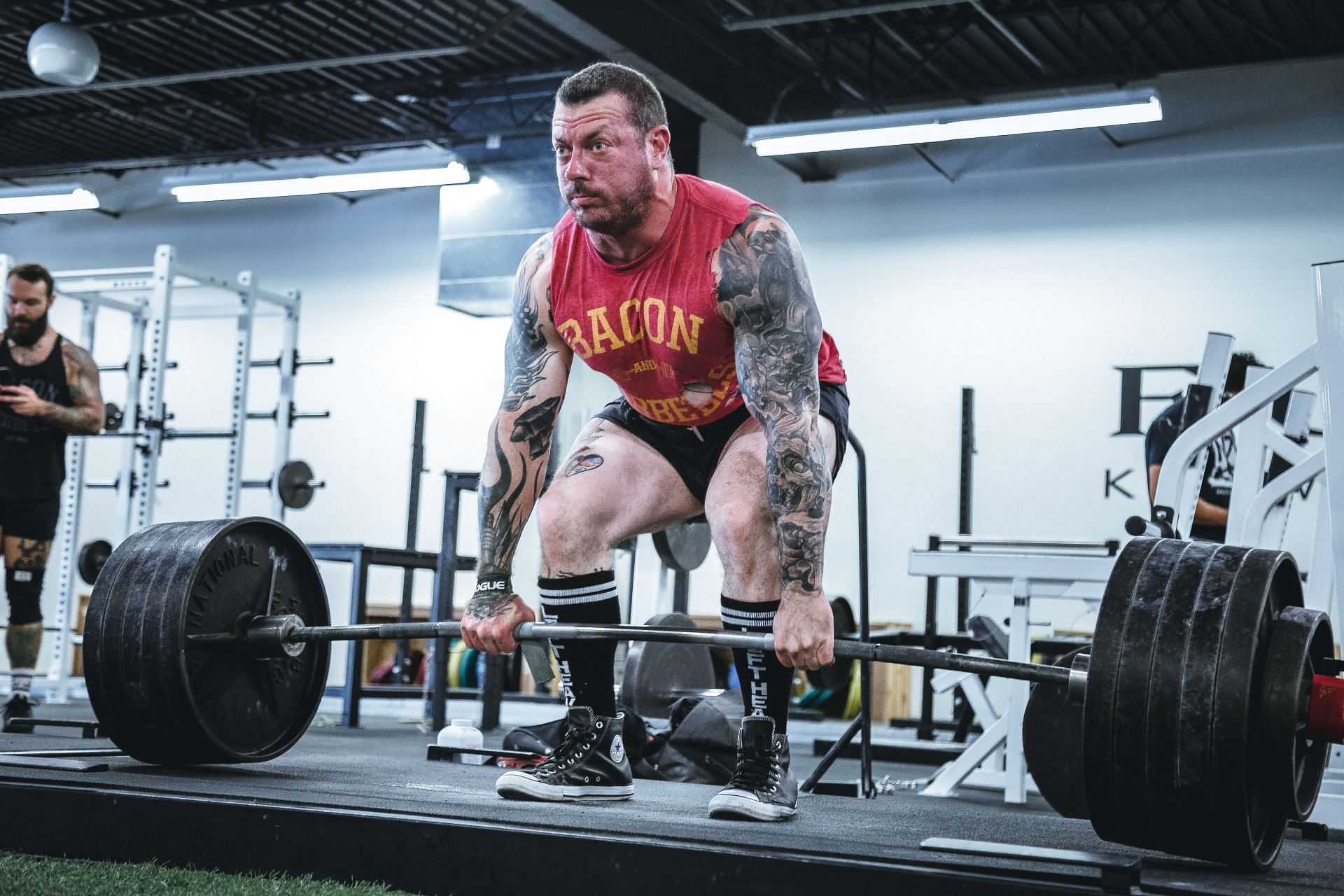 Deadlifts involve raising dead weight from the ground, which is pretty well implied by the name. (Image via Unsplash/ Alora Griffiths)