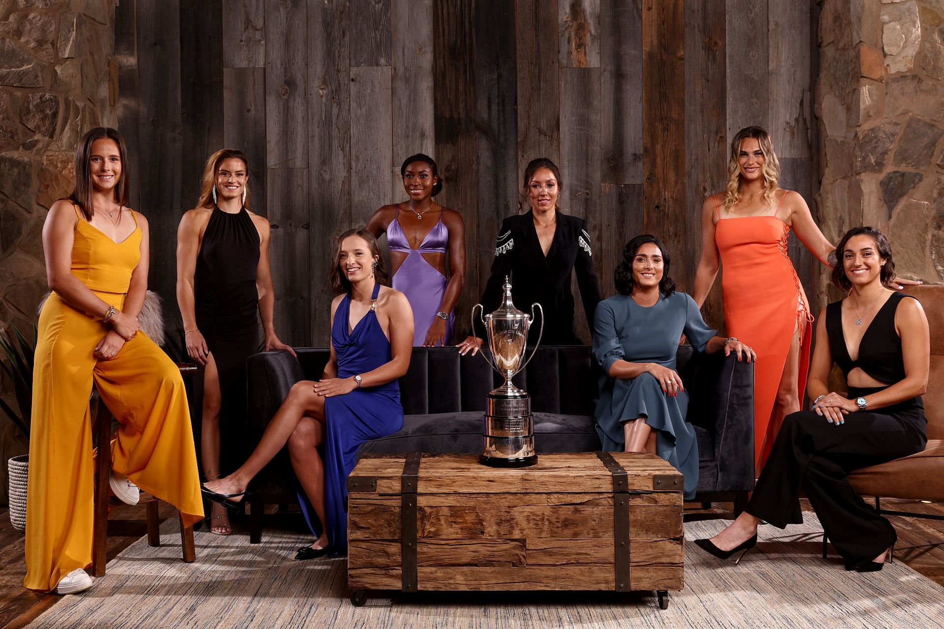 The top eight singles players pose with the Billie Jean King Trophy at the 2022 WTA Finals