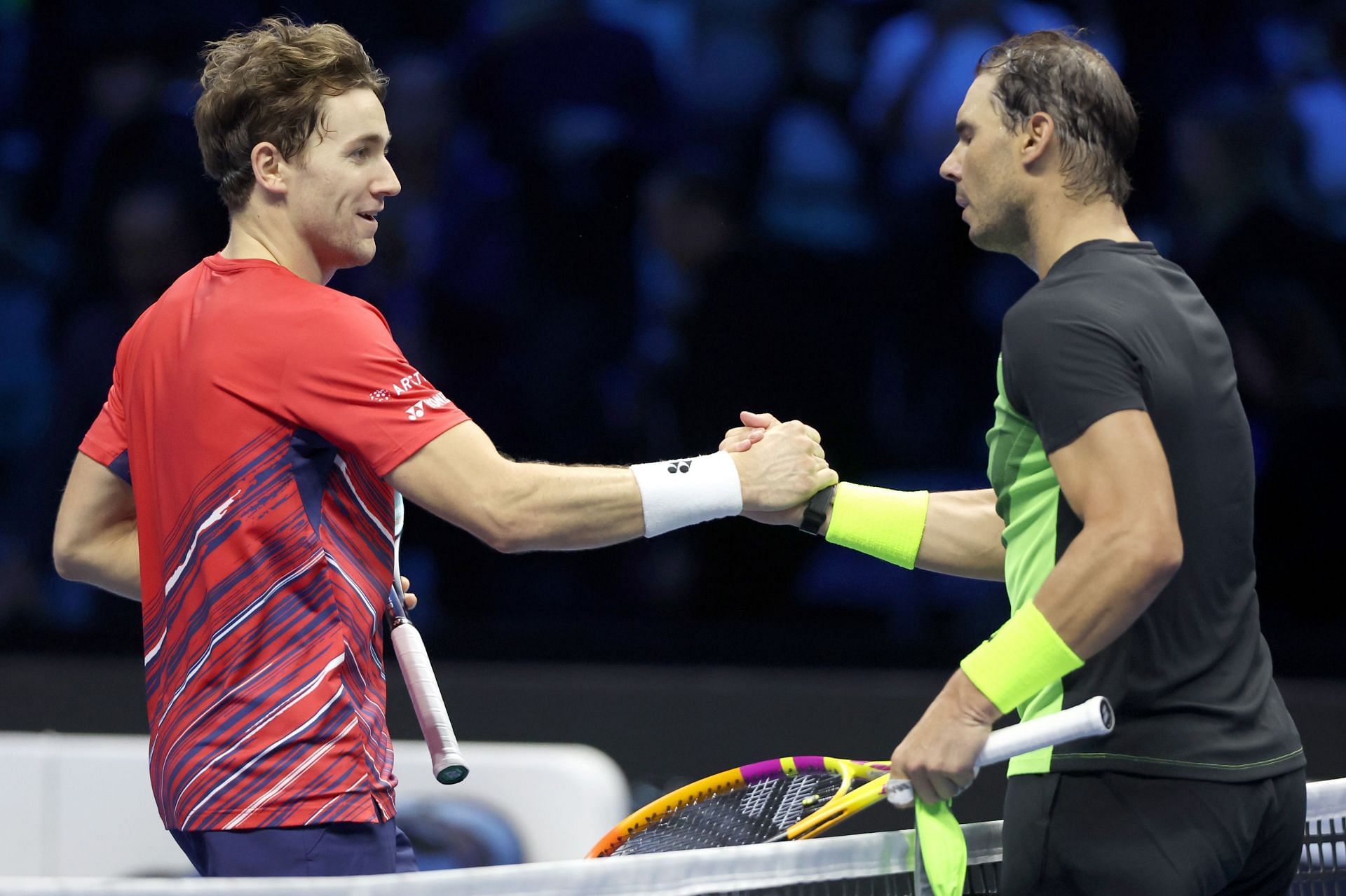 Casper Ruud (left) shakes hands with Rafael Nadal (right) after their round-robin match in the 2022 ATP Finals.