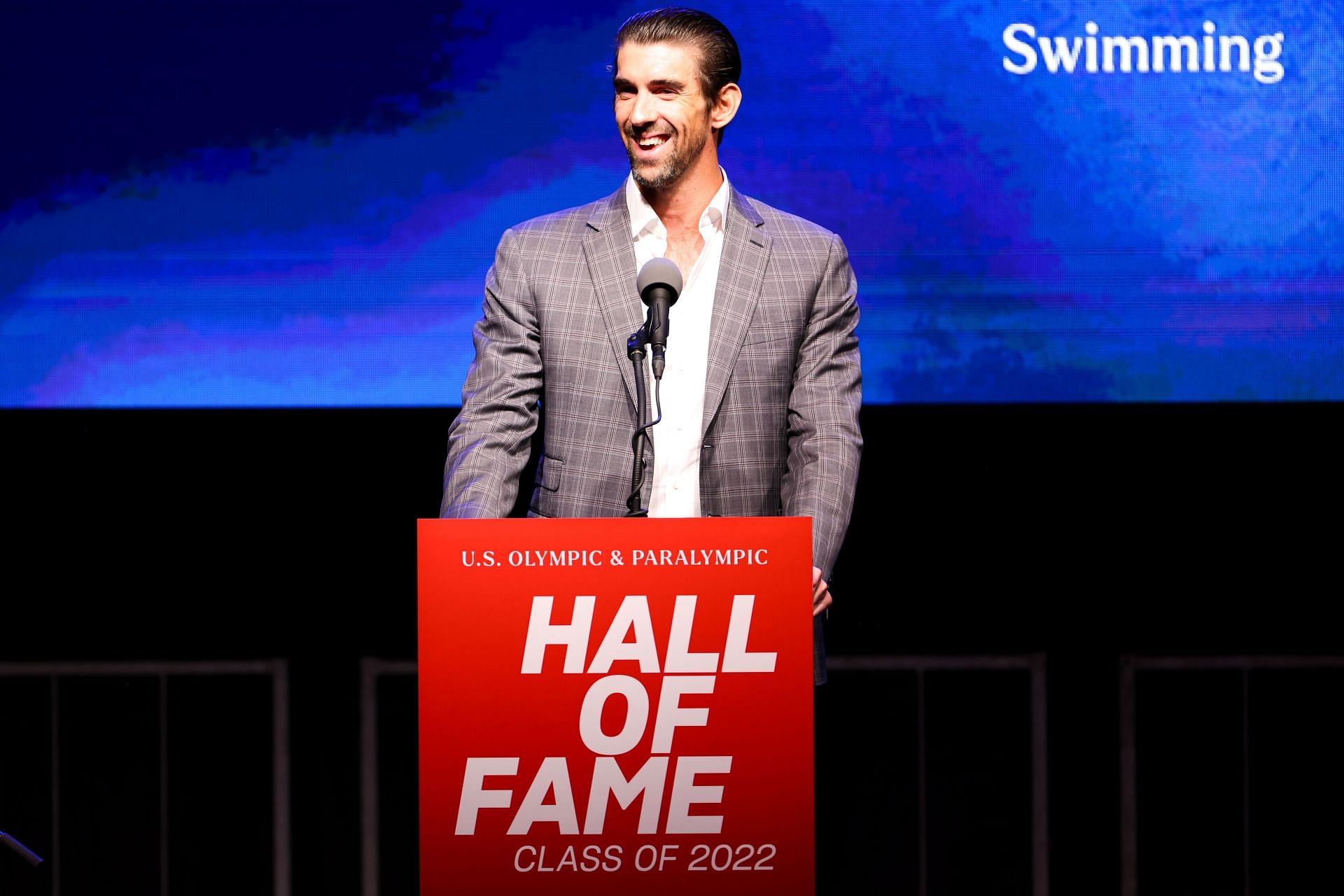 Phelps speaks at the 2022 U.S. Olympic & Paralympic Committee Hall Of Fame Ceremony (Image via Getty)