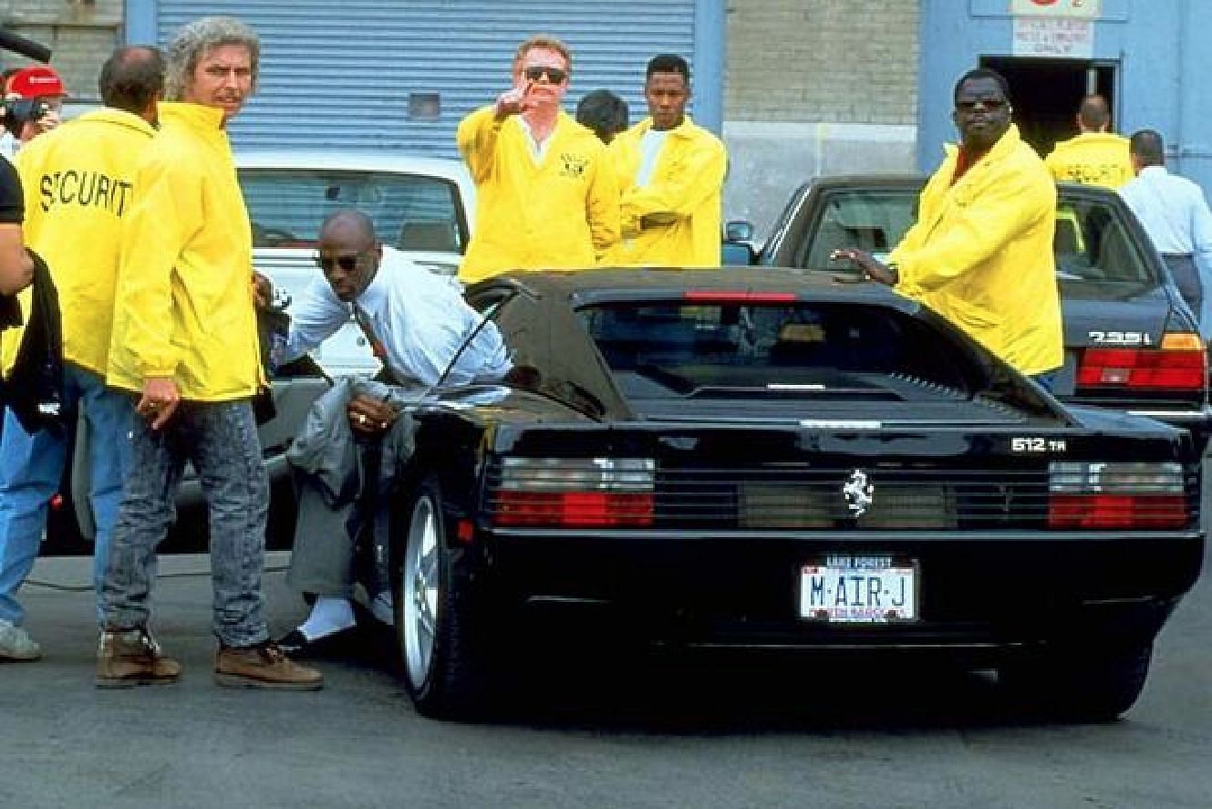 Michael Jordan stepping out of his Ferrari 512 TR