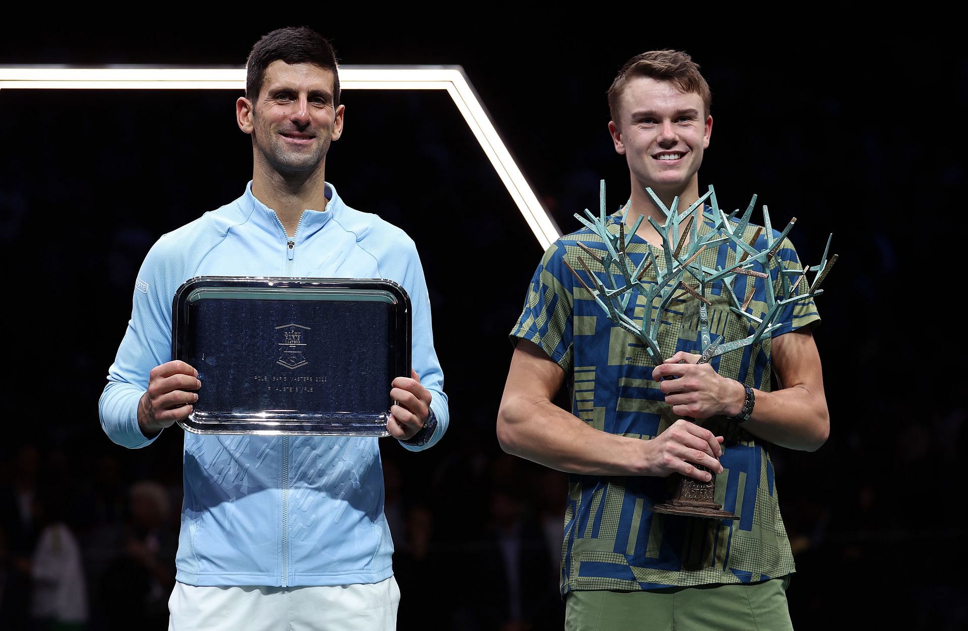 Holger Rune (R) and Novak Djokovic at Rolex Paris Masters - Day Seven.