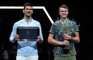 Holger Rune (R) and Novak Djokovic at Rolex Paris Masters - Day Seven.