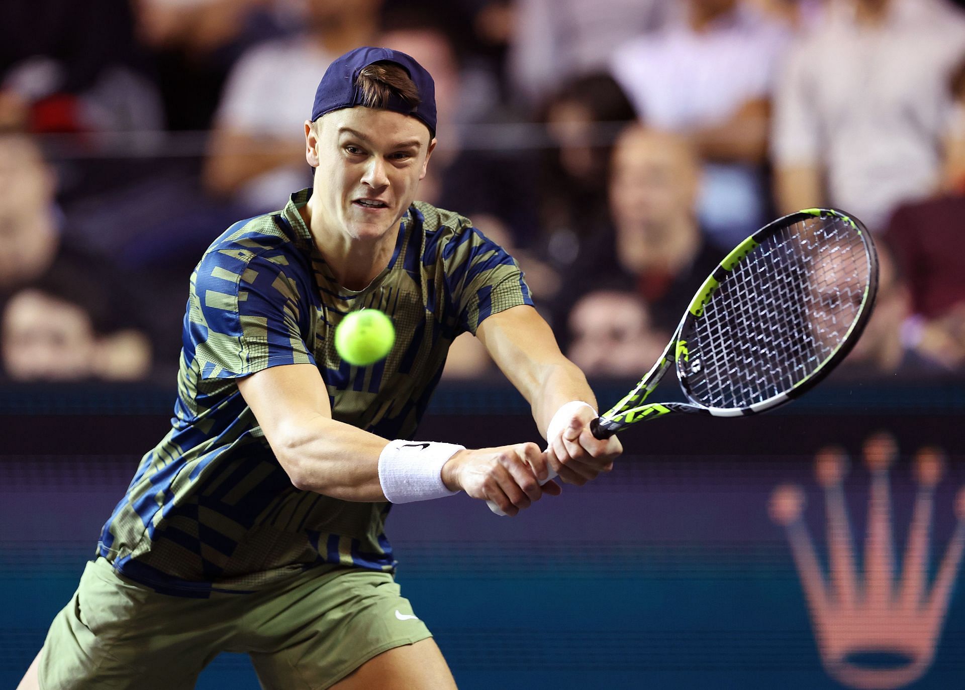 Holger Rune goes for a backhand against Hubert Hurkacz in their second-round match in Paris.