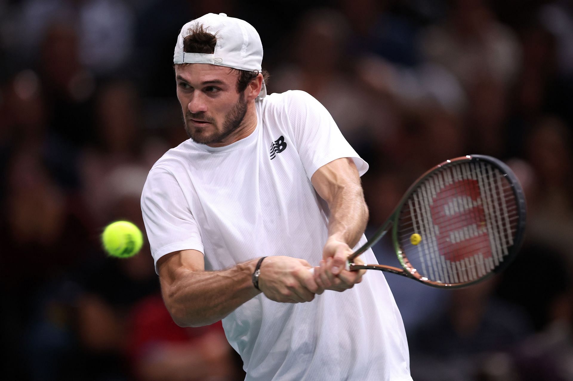 Tommy Paul in action against Stefanos Tsitsipas in the Quarterfinals at the Rolex Paris Masters