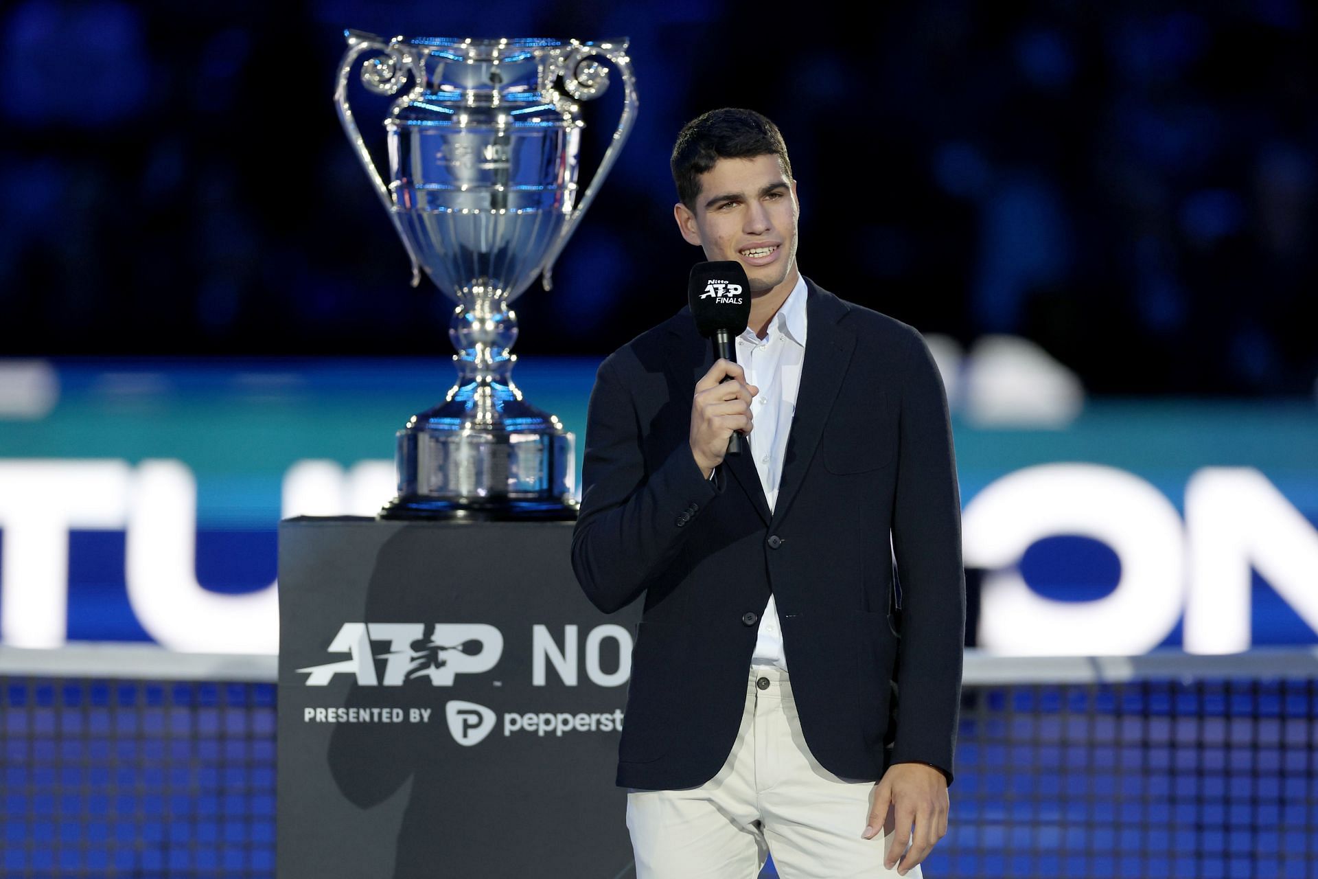 Carlos Alcaraz with the year-end World No. 1 trophy