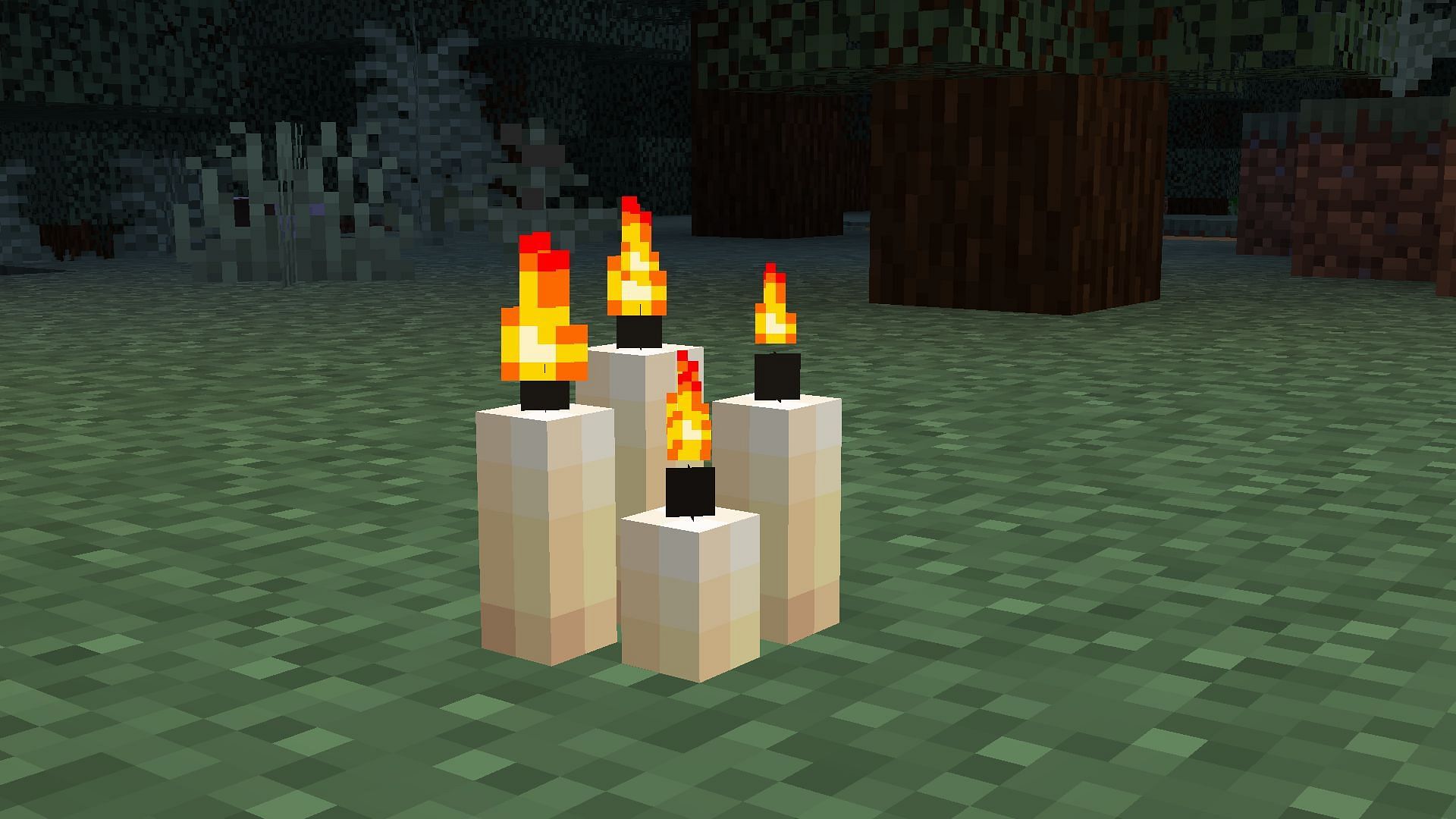Four lit candles emitting a light level of 12 in the game (Image via Mojang)