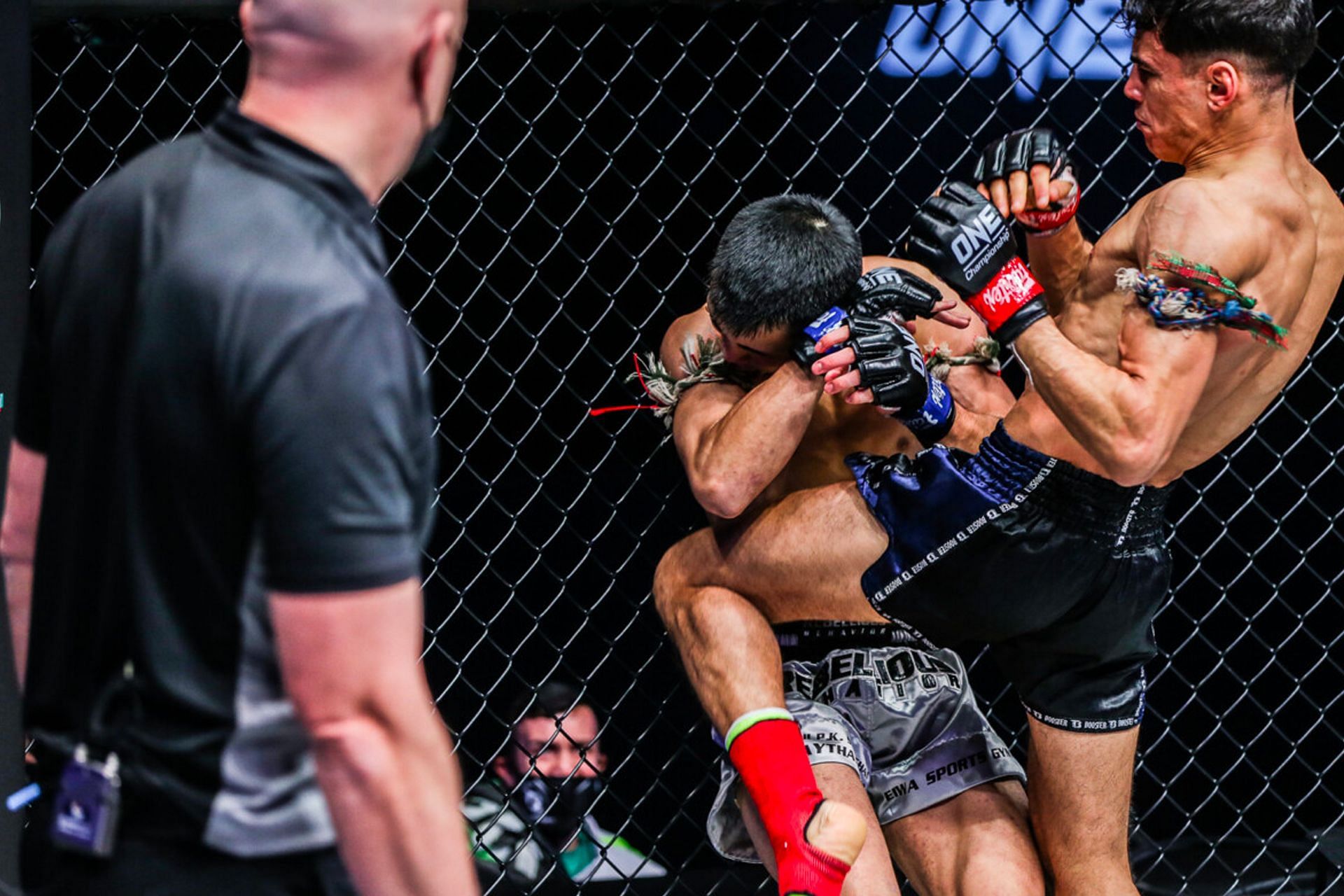 Joseph Lasiri hits Asahi Shinagawa with a knee. [Photo ONE Championship]