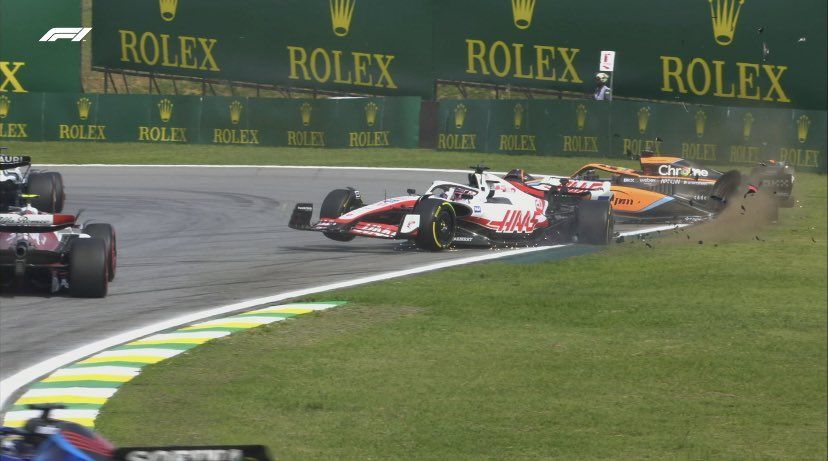 Kevin Magnussen (L) and Daniel Ricciardo (R) collide at the 2022 F1 Brazilian GP (Image credits: Twitter/@AshWoody90)