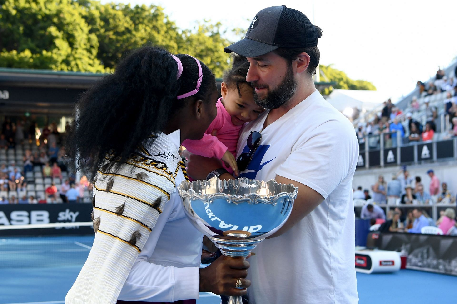 Serena Williams (left) celebrates her 2020 Auckland title win with Alexis Ohanian and Olympia.