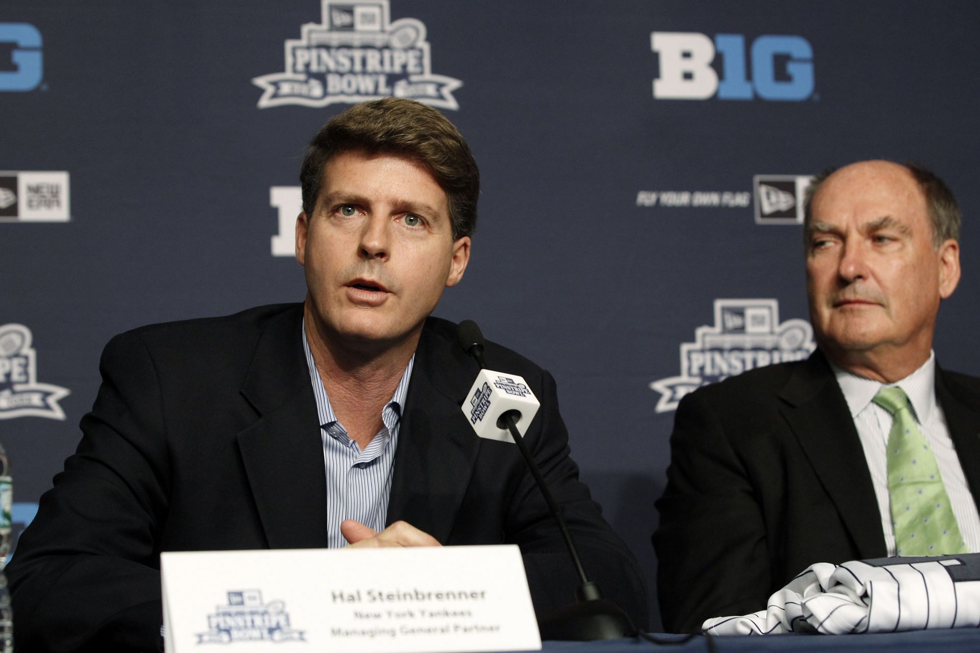 Hal Steinbrenner (L) and Jim Delany address the media during a press conference