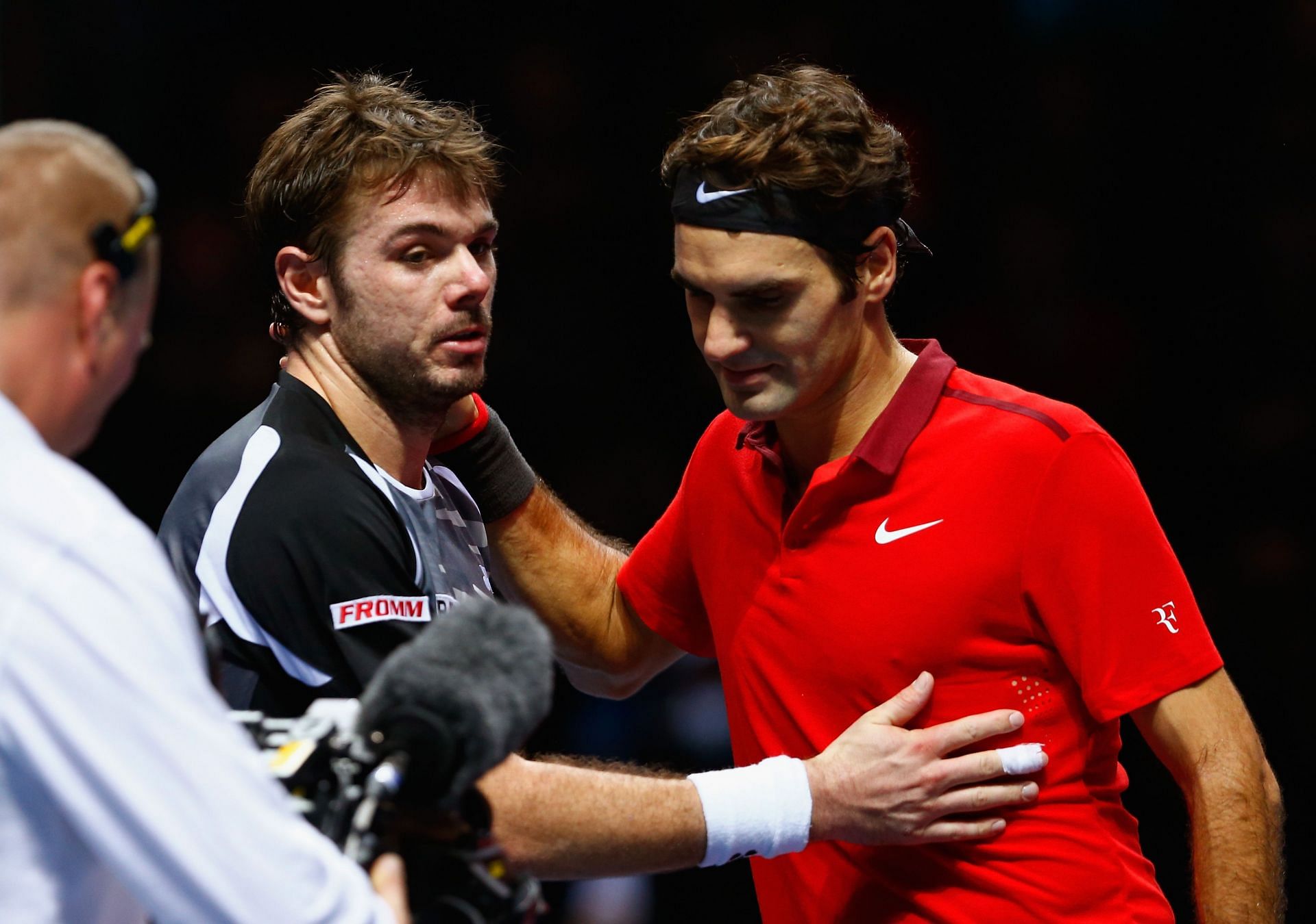 Stan Wawrinka (left) and Roger Federer (right) after their semifinal match in the ATP World Tour Finals in 2014