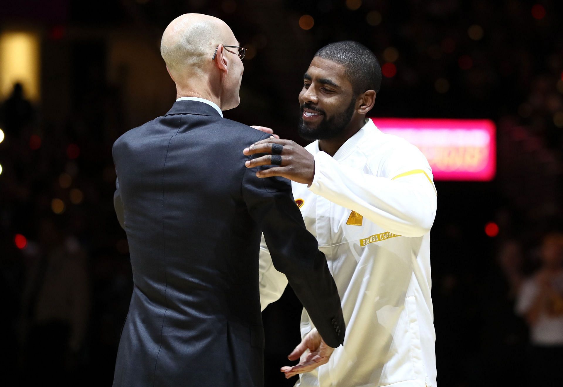 Adam Silver with Kyrie Irving (right)