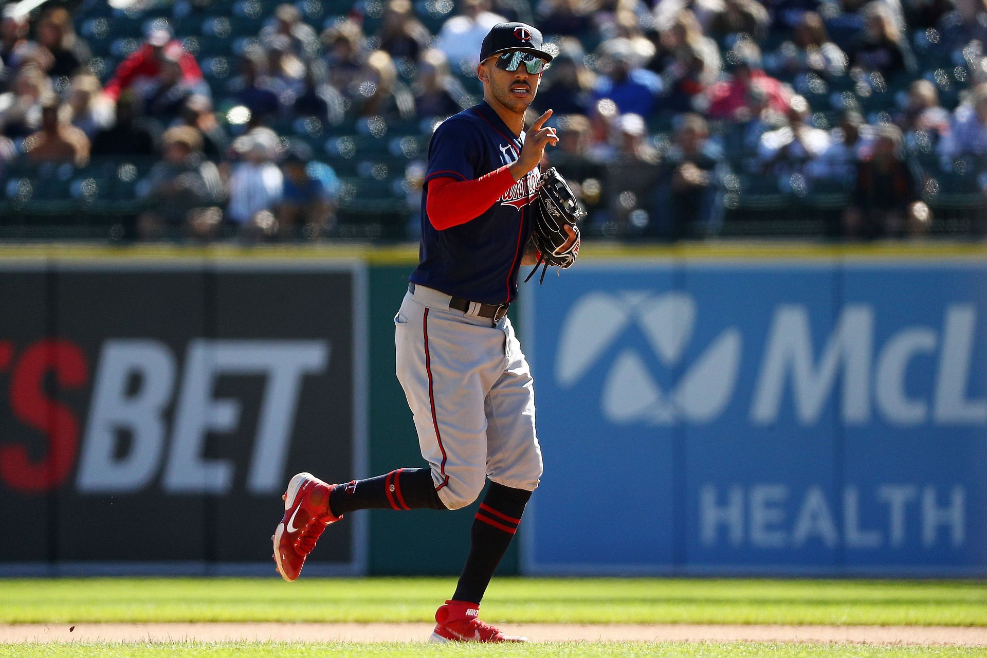 Carlos Correa #4 of the Minnesota Twins runs back to the dugout