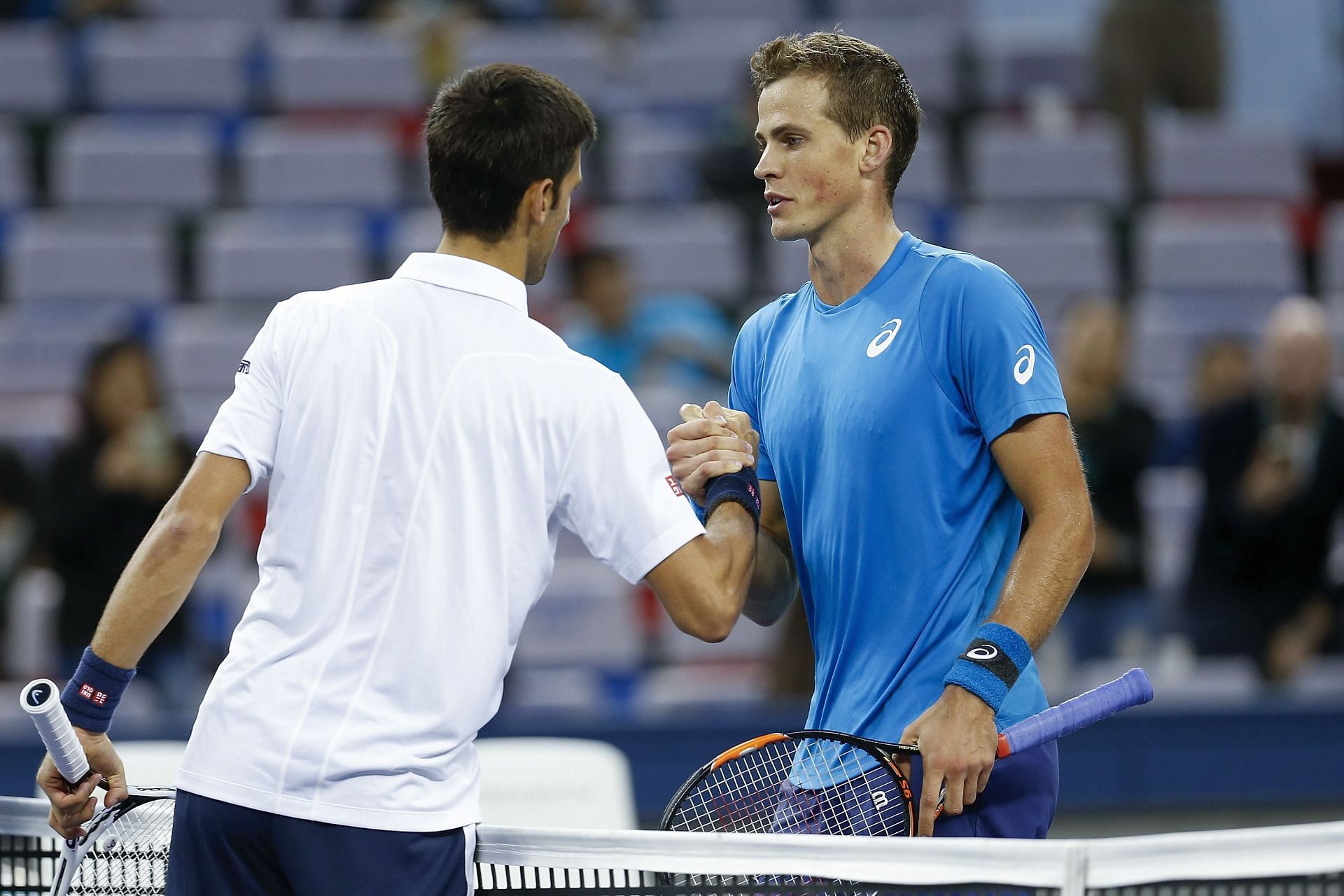 Novak Djokovic (L) and Vasek Pospisil