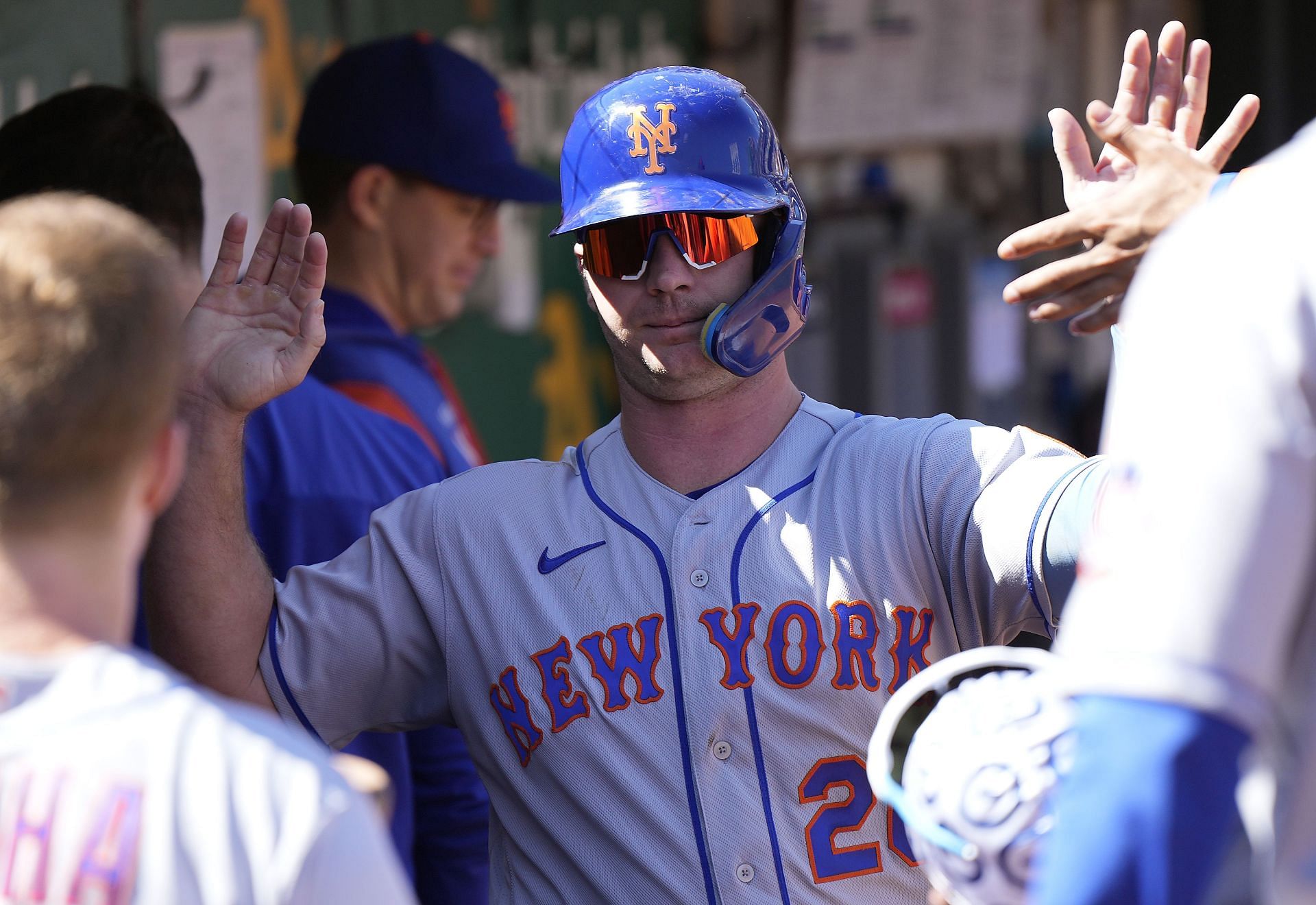 Pete Alonso #20 of the New York Mets is congratulated by teammates