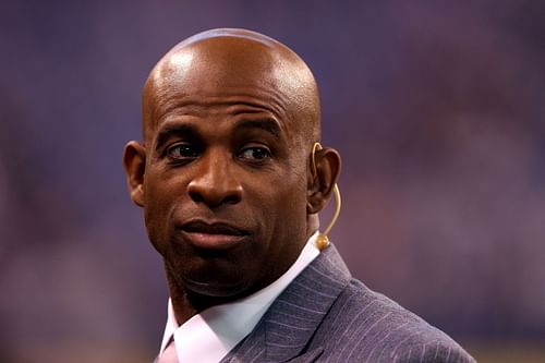 Deion Sanders in a suit at Super Bowl XLVI