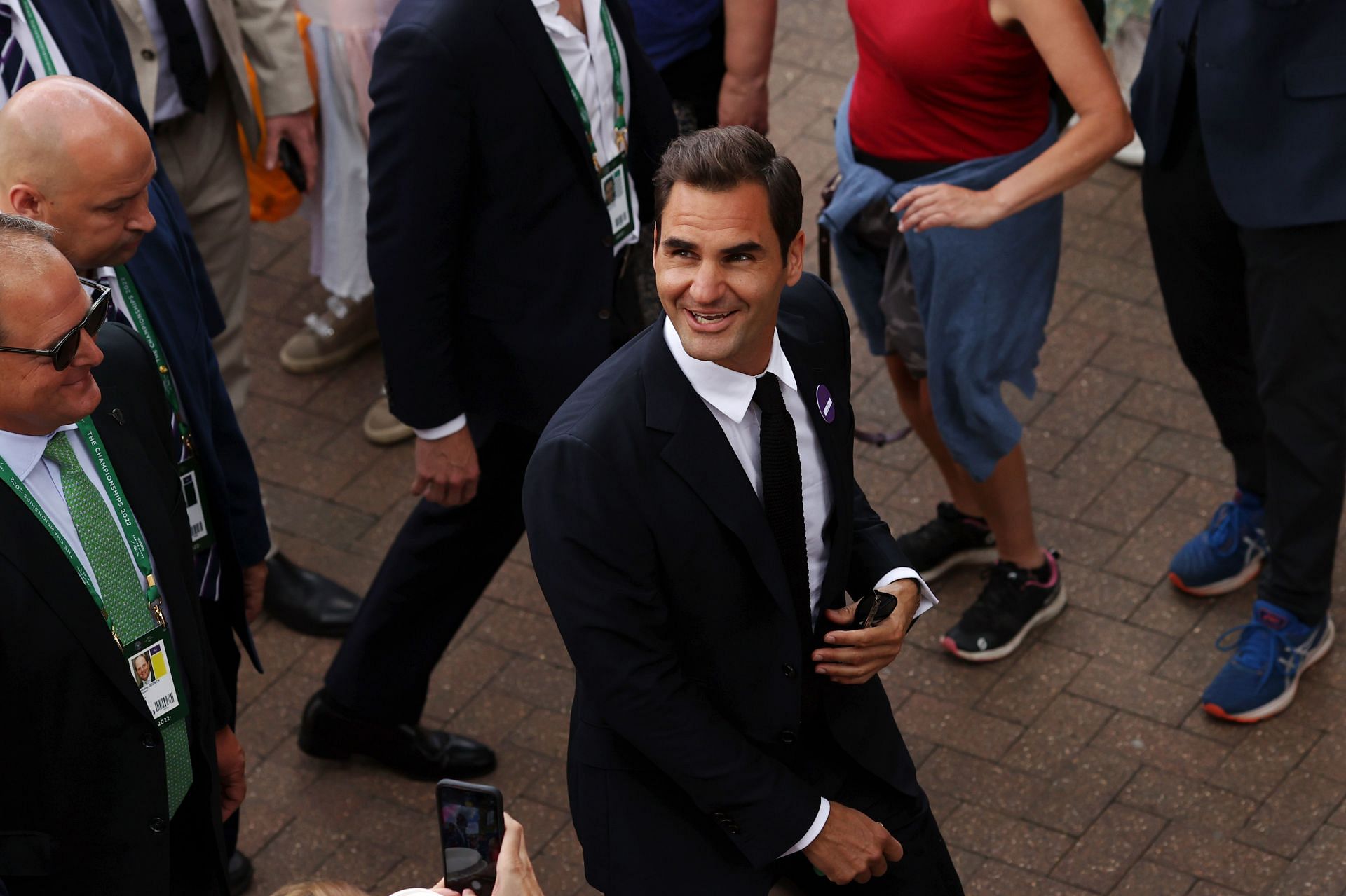 Roger Federer smiles during his visit to Wimbledon for the 2022 championships.