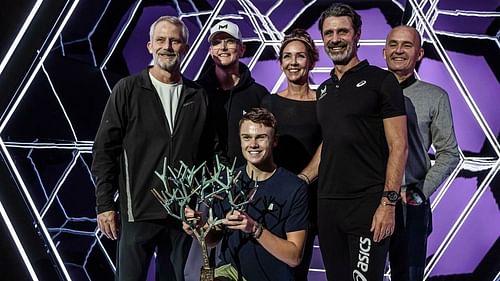 Holger Rune pictured with his team.