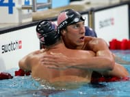 Phelps celebrates his 100m butterfly win at the 2004 Olympics