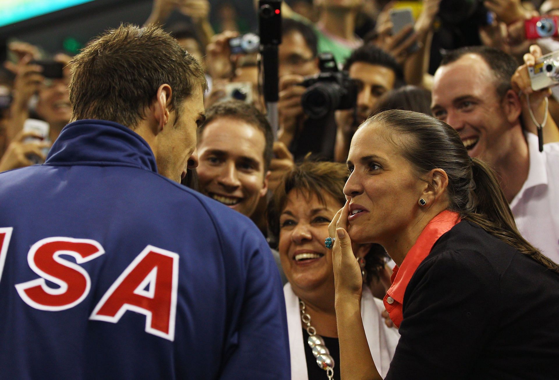 Michael Phelps talks to mother Debbie and sister Hilary at 14th FINA World Championships, 2011 (Photo by Quinn Rooney/Getty Images)